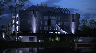 Widok sugestwynie podświetlonego budynku oraz stawu / A view of the lightining of the pond and the building